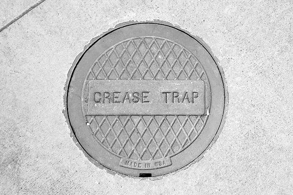 neglecting grease trap pumping can lead to clogs, backups, and costly plumbing repairs